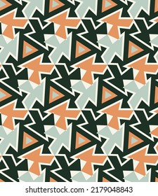 Colorful motley seamless pattern with African motifs. Overlapping art forms, stripes, polygons, segments are grouped and arranged in a certain order. Vector. 