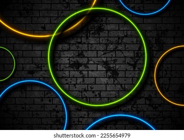 Colorful neon circles on grunge brick wall background. Vector retro design