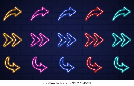 Colorful Neon Right Arrows Icons On Dark Wall Background. Location Indicator Casino, Bar, Night Club, Cinema And Motel. Glowing Neon Arrows Of Different Colors. Isolated Vector Illustration.