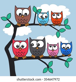 colorful owls in a tree