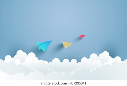 colorful paper airplanes flying over the clouds. design with art paper and craft.