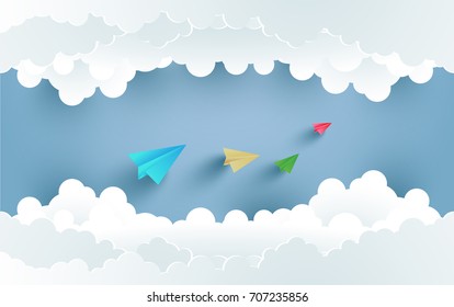 colorful paper airplanes flying over the clouds. design with art paper and craft.