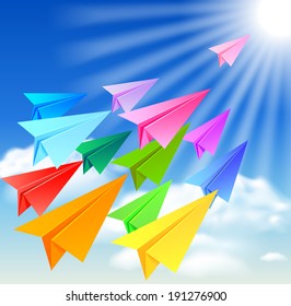 Colorful paper airplanes flying in the sky