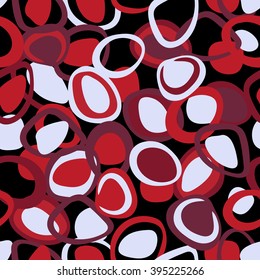 Colorful pattern in red and purple colors. Seamless texture with rings and ovals on black background. Stylish and abstract
