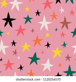 Colorful pattern of stars on pink background. From top view. Textile design for bedclothes, pillows, curtains, clothes