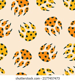 Colorful paws of wild big cat hand drawn vector illustration.Vintage leopard print seamless pattern for fabric or wallpaper.