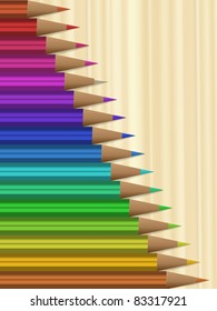 Colorful pencils on wooden background