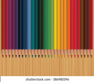 Colorful pencils on wooden table. Top view. 28 colors.