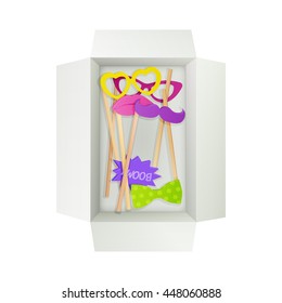 colorful photo props (lips, glasses, bow, mustache, comic sound) in open white cardboard box