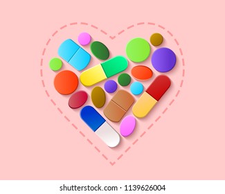 Colorful pills, tablets and capsules arranged in a heart shape on a light pink and rosa background. Health and pharmaceutical medicine concept.