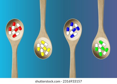 Colorful pills-capsules of medicines, vitamins or supplements in wooden kitchen spoons on blue background. Concept of medicine and health