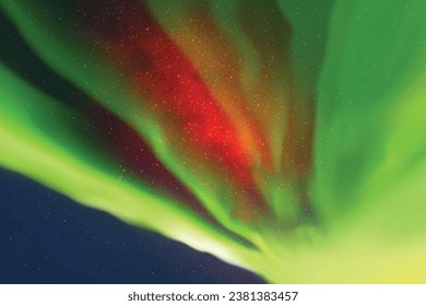 Colorful polar lights. Night starry sky. Red green aurora borealis
