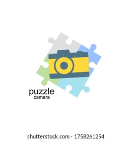 Colorful puzzle camera logo featuring four interlocking pieces in different hues, representing creativity and innovation in photography, perfect for camera brands or photography services.