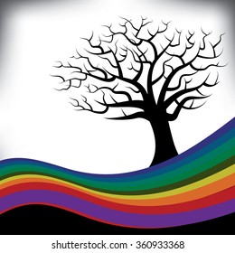 A colorful rainbow frames a bare tree