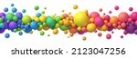 Colorful rainbow matte balls in different sizes. Abstract composition with multicolored flying spheres. Vector background