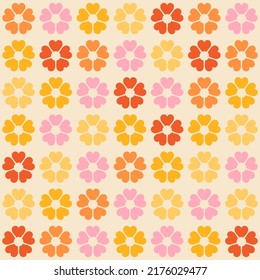 Colorful retro background. Geometric abstract seamless pattern . Vintage stylised flowers, placement by grid. Cheerful floral surface design print in old school 60s, 70s