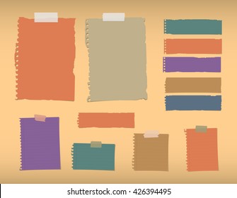 Colorful ripped blank, lined note paper are stuck on orange background.