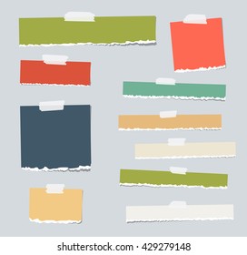 Colorful ripped blank note paper are stuck on gray background