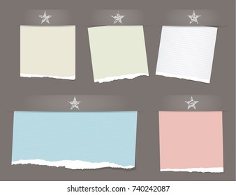 Colorful ripped, notebook, notepad paper sheets, note for text or message with stars on brown background.
