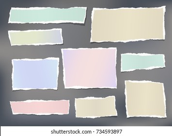 Colorful ripped striped note, copybook, notebook paper stuck on gray background.