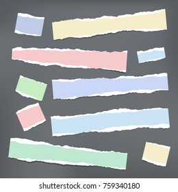 Colorful ripped strips, notebook, note paper for text or message stuck on dark gray background.