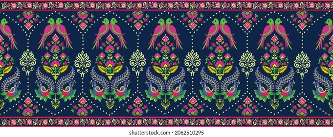 Colorful seamless border  pattern with fantasy ornate peacock, parrot, and classic floral motifs on a navy blue background