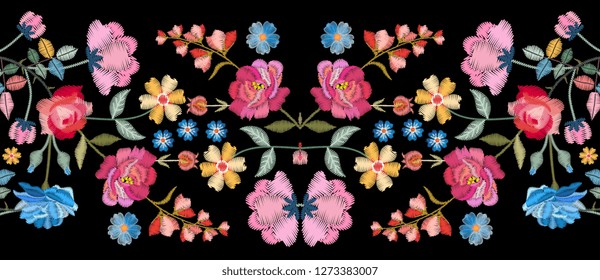 Colorful seamless embroidery border with beautiful flowers. Floral embroidered pattern on black background. Fashion print.