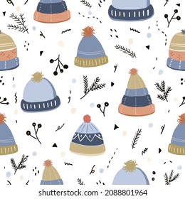 Colorido y sin costuras dibujado a mano   patrón con sombrero de punto de colección, invierno, navidad y año nuevo sobre fondo blanco