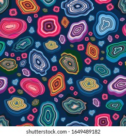 Colorful seamless pattern with agates, stones and gemstones on dark blue background, vector illustration