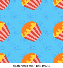 Colorful seamless pattern of appetizing cupcakes on a blue background. Simple flat vector illustration. For the design of paper wallpapers, fabric, wrapping paper, covers