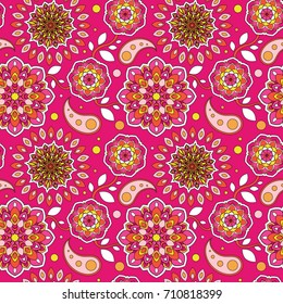 Colorful seamless pattern. Beautiful floral motif. Background in oriental style. The template for printing on fabric. Texture of mandalas on a scarlet surface.