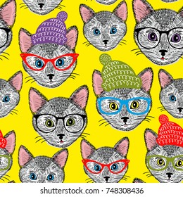 Colorful seamless pattern with cats in hats and glasses. Vector background.