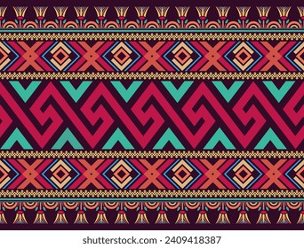 Colorful seamless pattern design in vintage style with Greek key, geometric, and Egyptian lotus motifs on a dark purple background. Use for fabric, textiles, clothes, skirts, wrapping, and wallpaper.