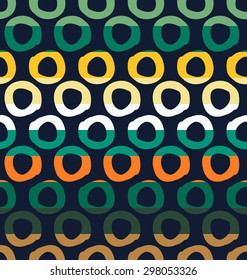 Colorful seamless pattern with dot and sun elements separated by color stripes on dark background.