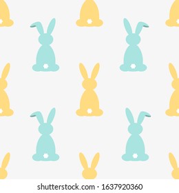 Colorful seamless pattern with easter bunny. Vector illustration for funny holiday design. Background for post or greeting card. Cute wallpaper with rabbits. yellow, blue color