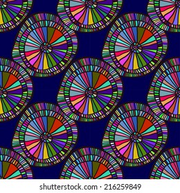 Colorful seamless pattern in ethnic style, African motifs. Bright circular disks on a dark blue background.  