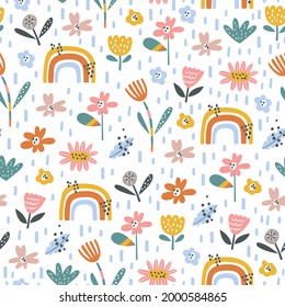 Colorful seamless pattern with rainbow and flowers. Summer floral repeat background for fabrics or wallpapers. Creative Scandinavian kids texture
