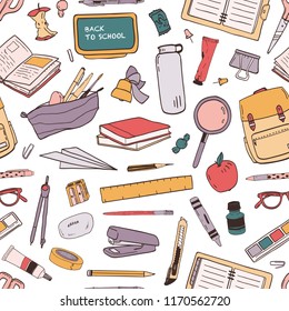 Colorful seamless pattern with scattered school supplies or stationery for education on white background. Hand drawn vector illustration in realistic style for wallpaper, wrapping paper, fabric print.