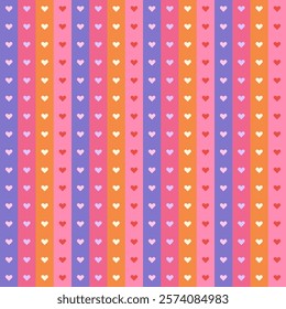 Colorful seamless pattern with small hearts on pink, purple, and orange vertical stripes. Playful and bright vector background for love-themed projects, wrapping, packaging, fabric, scrapbooking, etc.