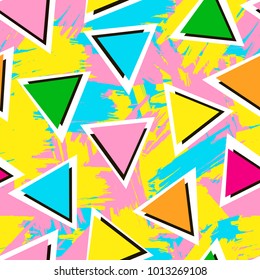 Colorful seamless pattern from triangles on the bright brush strokes background. 80's - 90's years design style. Trendy. Vector illustration