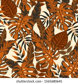 Colorful seamless pattern with tropical leaves on a delicate background. Floral tropical pattern background with exotic leaves, jungle leaf. Illustration in Hawaiian style. Jungle leaves.