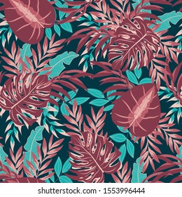 Colorful seamless pattern with tropical plants on dark background. Jungle leaves. Floral pattern. Vector background for various surface. Exotic wallpaper. Trendy summer print.