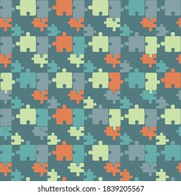 Colorful seamless puzzle pattern. Vector pattern with colorful puzzle in green background. Abstract modern cartoon style. Puzzle print for textile, fabric, package, wrapping paper, backdrop, tile