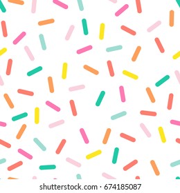 Colorful seamless vector confetti pattern.  Bakery themed donut, doughnut or cupcake sugar sprinkle background.