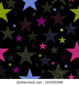 Colorful seamless vector pattern with abstract multicolor stars on an black background. Stars and scrapes are laid out in an interesting seamless pattern.