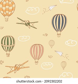 Colorful seamless vector pattern, hand drawn hot air baloons flying in the sky. Pattern for backgrounds, wrapping paper, fabrics and bed clothes