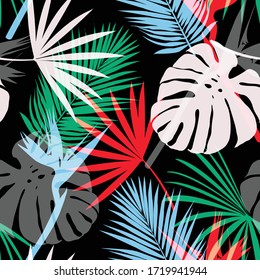 Colorful silhouette of Tropical leaves seamless pattern vector EPS10 in the dark night ,Design for fashion,fabric,cover,web,wallpaper,wrapping and all prints on black