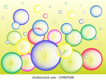 Colorful soap bubbles on yellow background