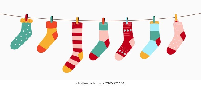 Colorful socks hanging on a rope. Cotton and woolen socks isolated on white background. Sox with different drawings, patterns and design. Vector illustration.