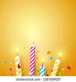 Colorful sparkling candles on orange background. Birthday, anniversary or celebration template.